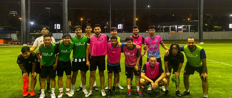 KickHub community group photo after a pickup football game in Bangkok