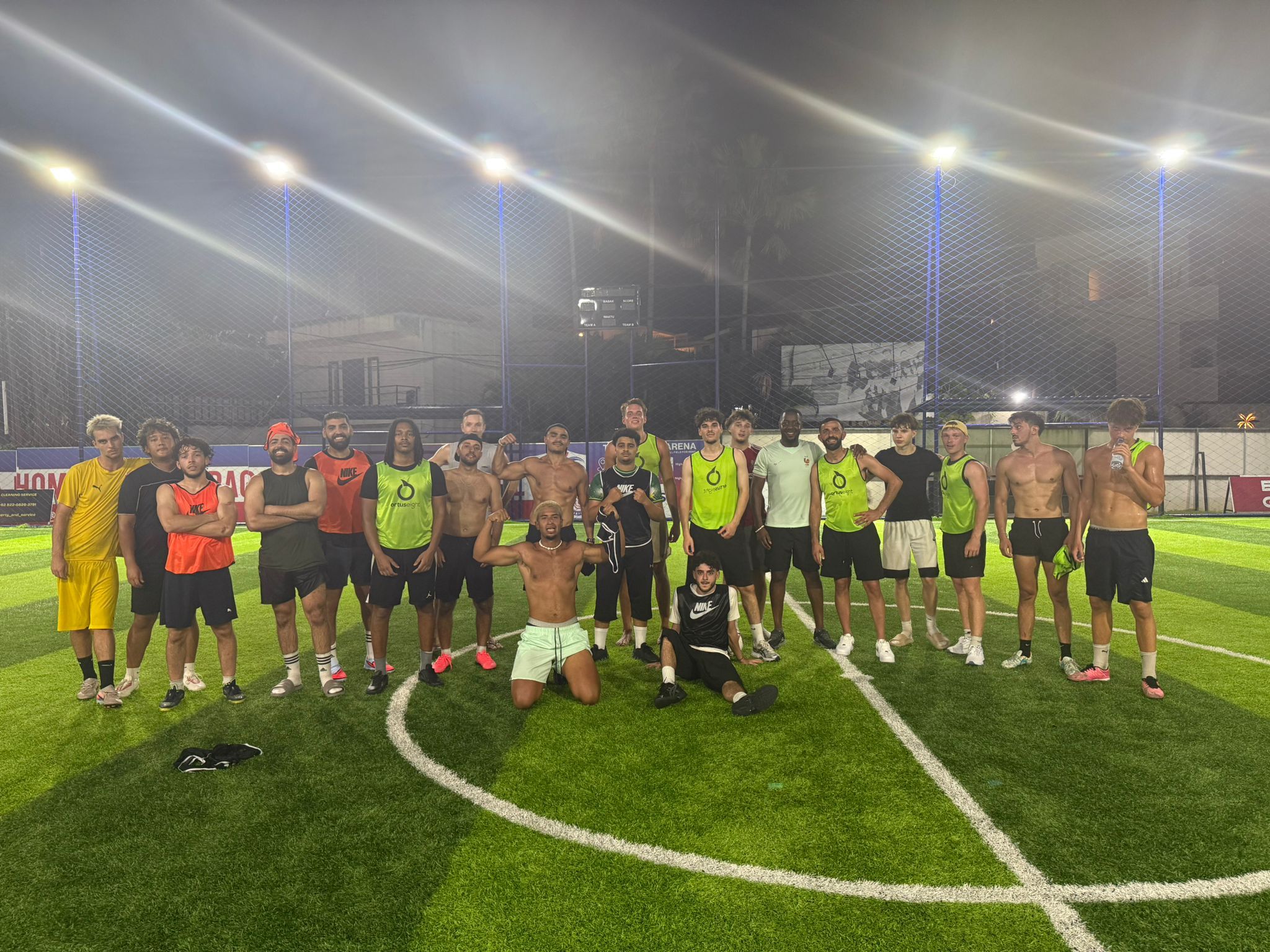 KickHub community group photo after a pickup football game in Bali