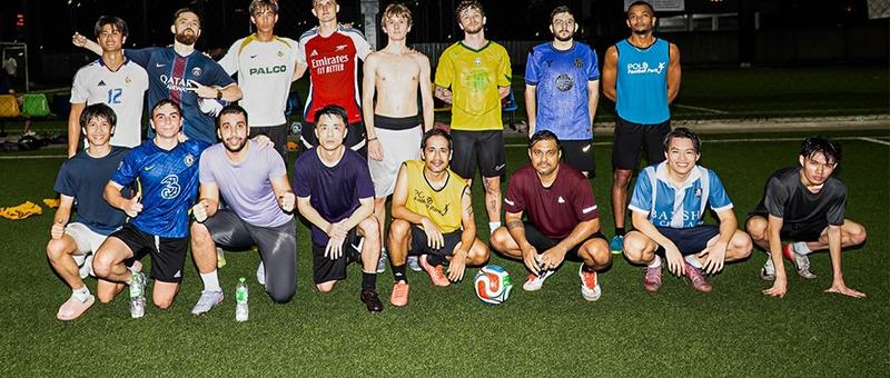 Players during an 11-a-side football match on the full-size synthetic pitch at Hybrid Football Field in Bangkok